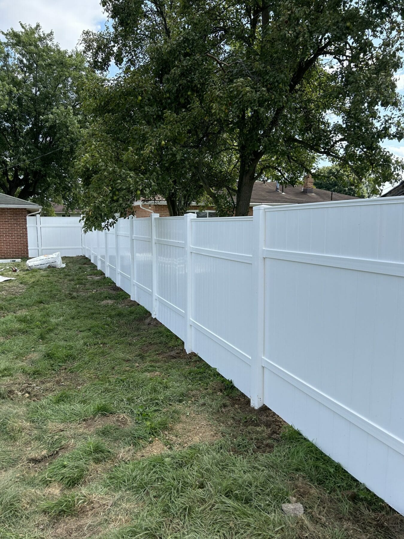New White fence installed around yard
